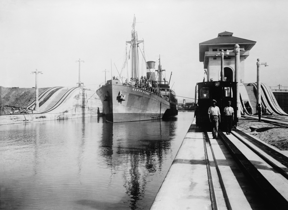 Ships moves through the Miraflores Lock of Panama Canal.