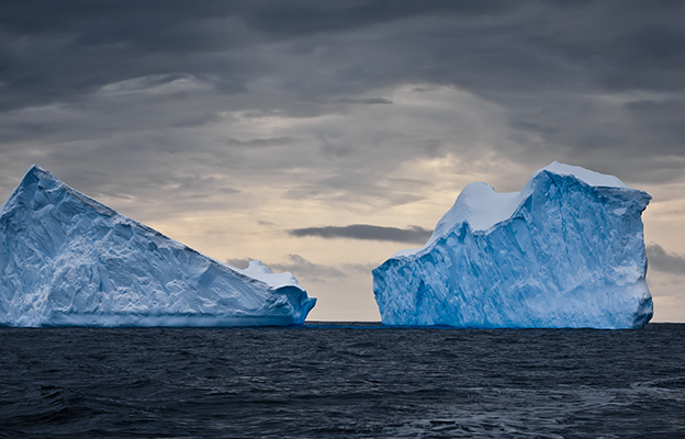 ominous clouds and icebergs in Antarctica