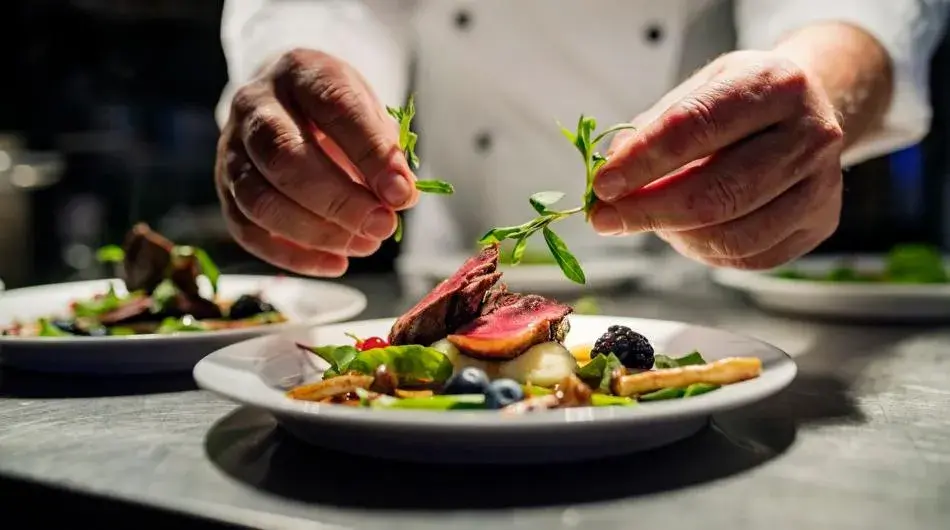 Chef preparing dinner on the Heritage Adventurer