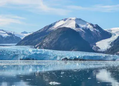 Pia Glacier in Patagonia with Darwin Mountains and calm waters