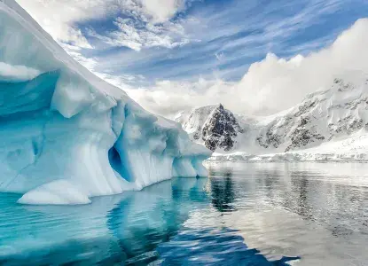 Bright blue water and icebergs in Antarctica 