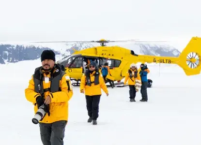 Tourists landing at Snow Hill in Antarctica by helicopter with photo by Michelle Sole