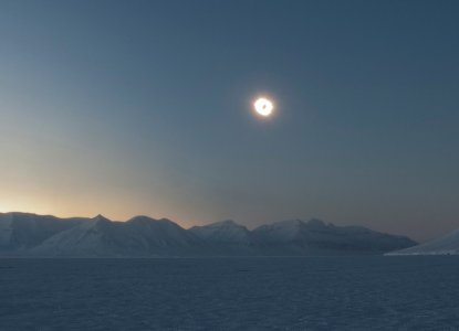 Panoramic view of Arctic landscape with solar eclipse