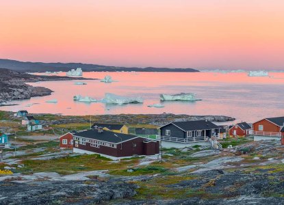 Panoramic view of Disko Bay with icebergs at sunrise